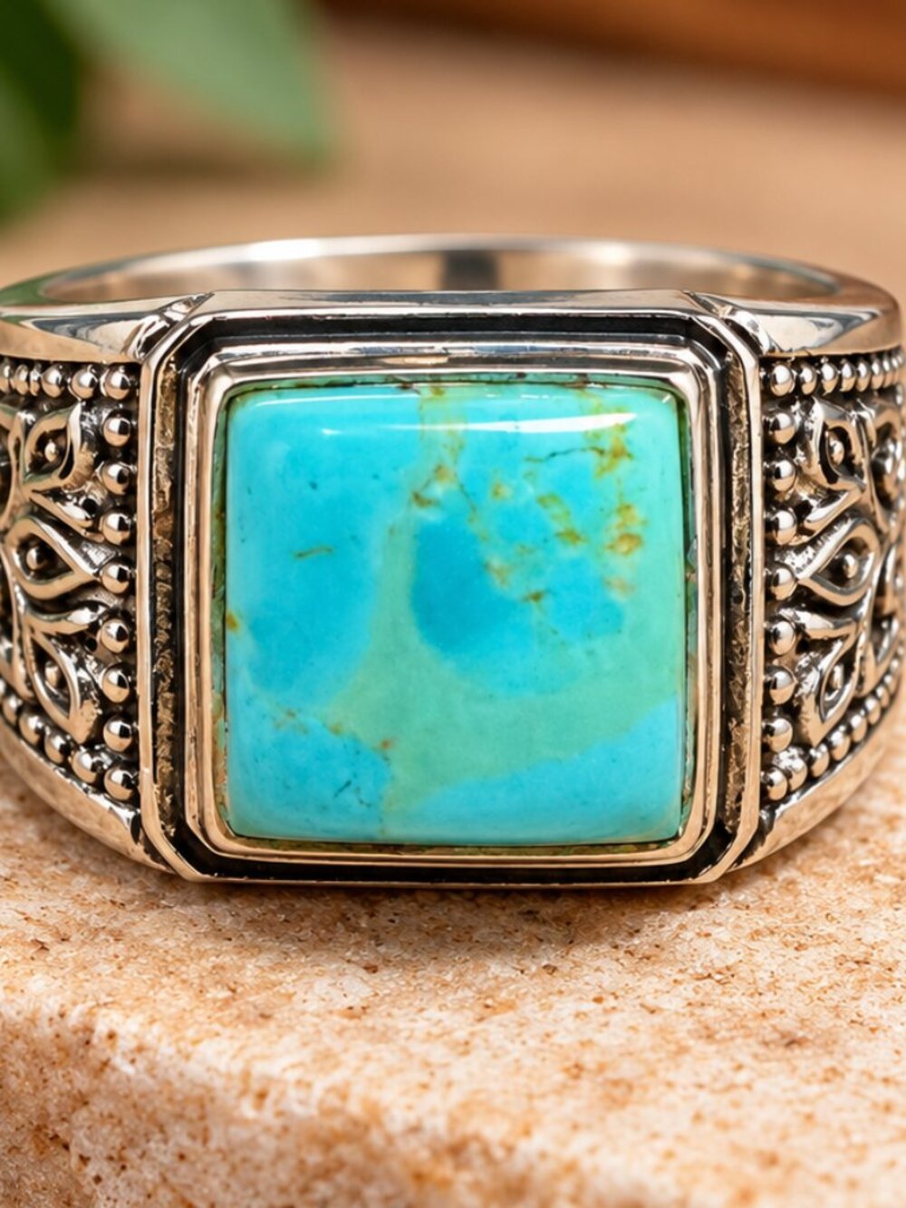 Men's sterling silver signet ring featuring a square-cut turquoise stone.